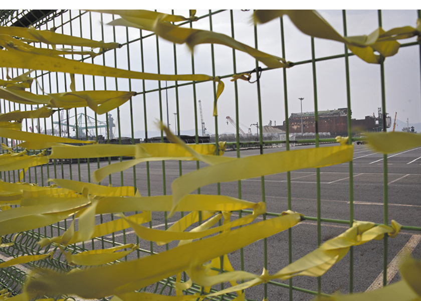 On the sixth anniversary of the sinking of the ferry ship Sewol off the coast of South Korea in 2014.  The ship is in dry dock in Mokpo while workers look for five, still missing, bodies of the 290 people who lost their lives.