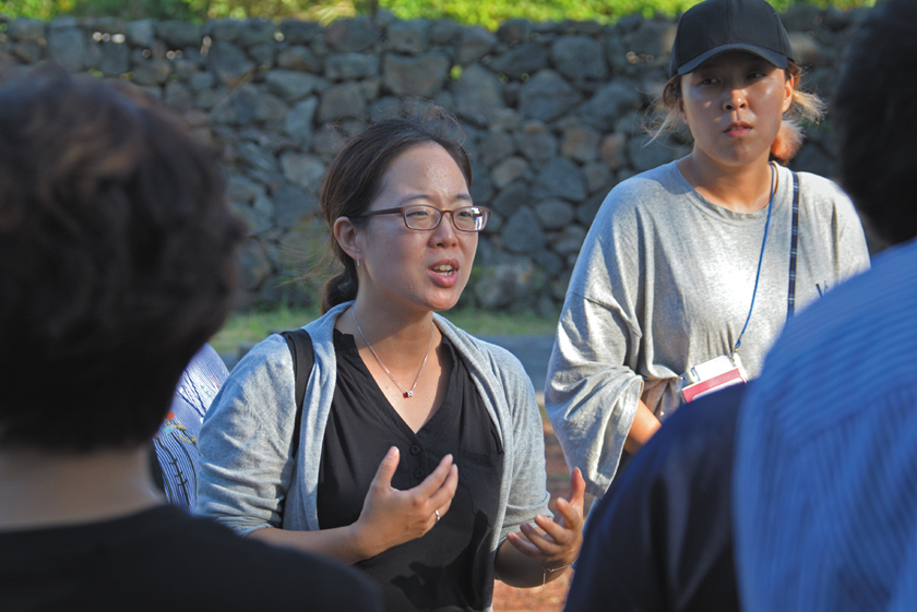 The Jeju Uprising and Dark Tours.   Gayoon Baek, founder of Jeju Dark Tours leads a  group of high school students to various sites.