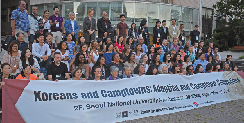 Adopted Korean Mosiac Hapa tour conference members pose in fron of the Asian Center at Seoul National University.