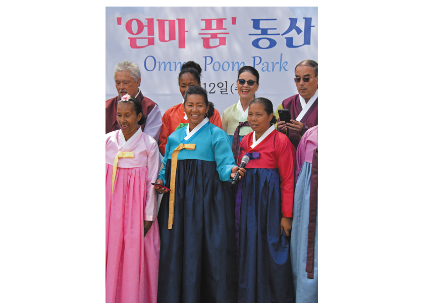 Adopted Korean Mosiac Hapa tour members sang together at the Omma Poom Park dedication near Paju, South Korea.  